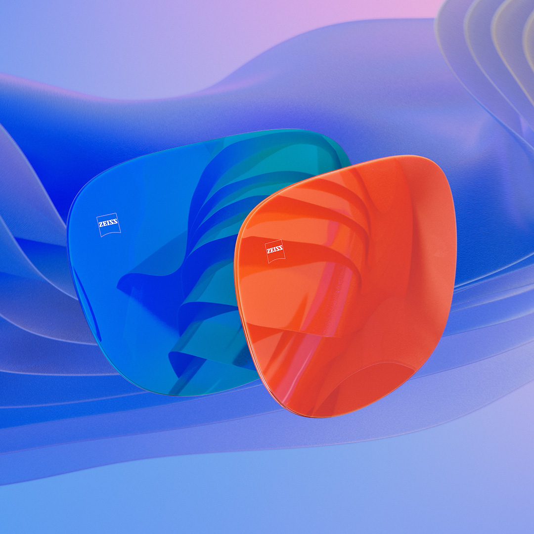 3D CGI ilustrácia dvoch šošoviek slnečných okuliarov s modrým a oranžovým zrkadlovým povrchom.