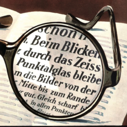 Obrázok starej reklamy na šošovky ZEISS Punktal ukazujúci jasné videnie cez celú šošovku. V roku 1912 to bolo niečo revolučné. 